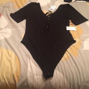 *Donating 7/22* - NWT lace up body suit